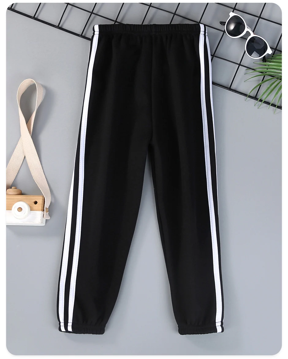 Autumn and winter children's solid color sports plus velvet pants boys and girls comfortable leisure warm sports fashion pants.